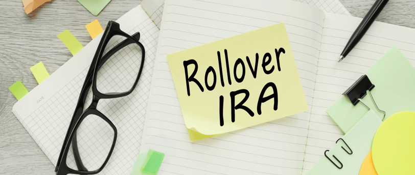 glasses and sticky notes for performing rollover to roth ira