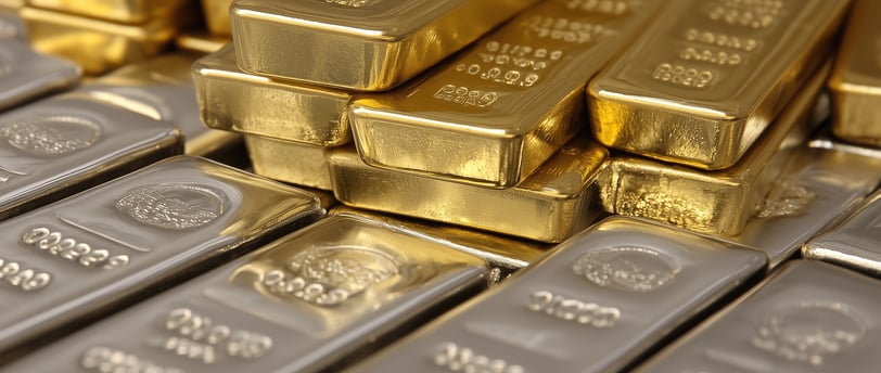 gold and silver bullion bars in multiple stacks