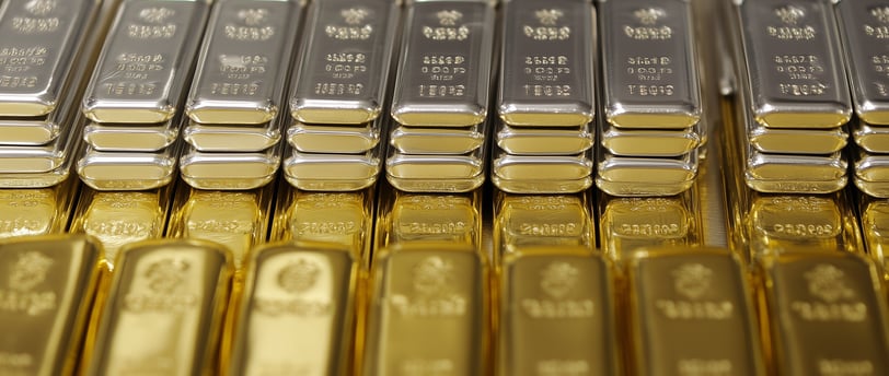gold and silver bullion bars in rows and stacks