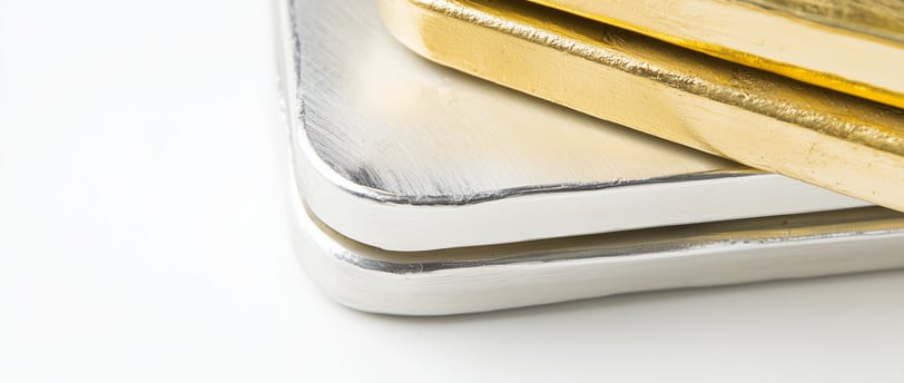 gold and silver bullion bars on top each other