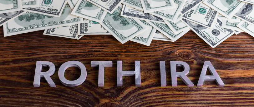 lots of money in a pile for the word roth ira