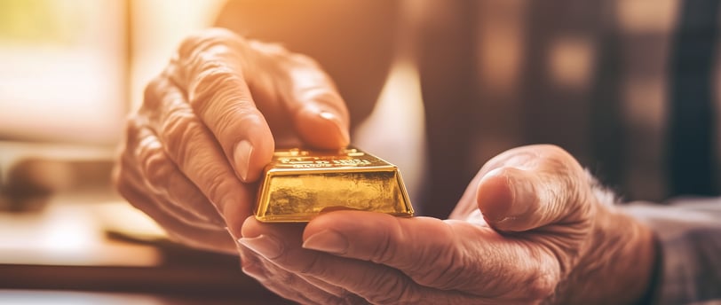 retiree holding a gold bar