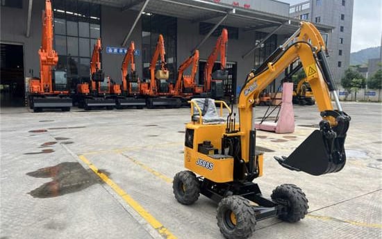 a small excavator with a crane on the back of it