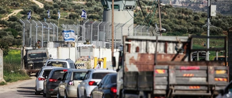 Palestinian vehicles queued at long lines in Qalqilya checkpoint, West Bank, amid Israeli military r