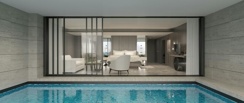 a pool with a view of a living room and a dining room