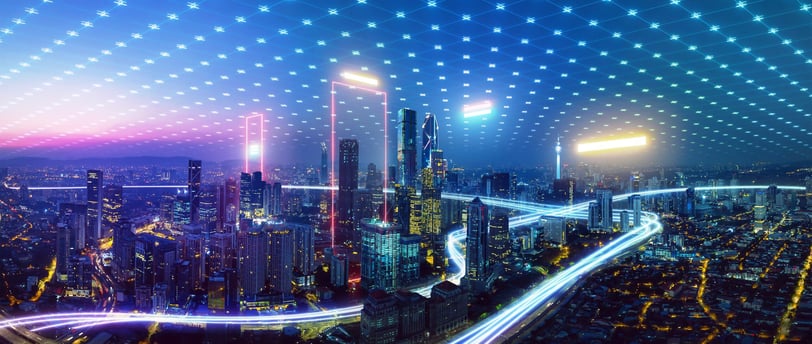 a cityscape with a lot of lights and a lot of traffic