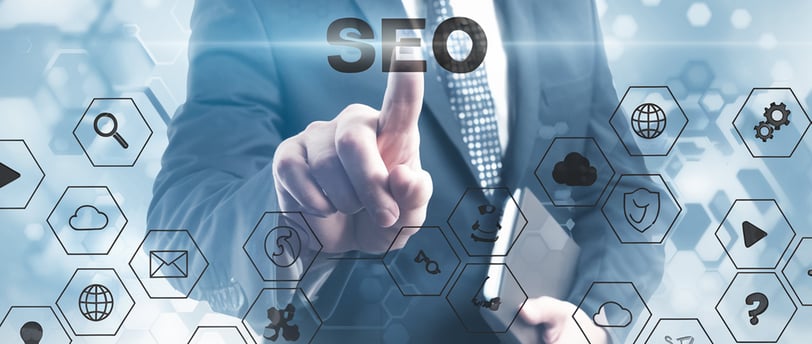 Business owner analyzing SEO reports on laptop for local search visibility