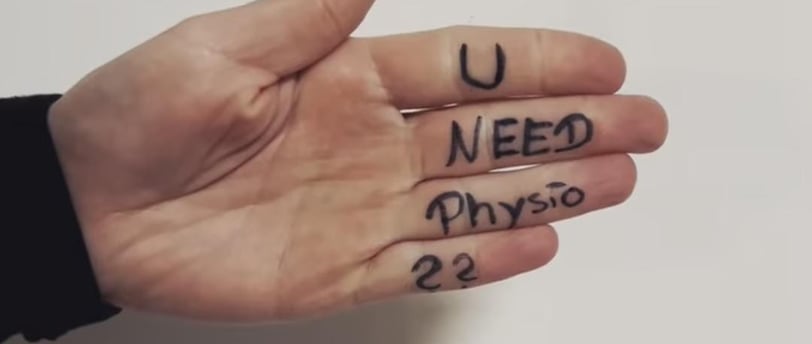 a person's hand with a handwritten u need physio