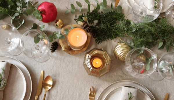 table decorating with lamps candles and plates and knife with fork