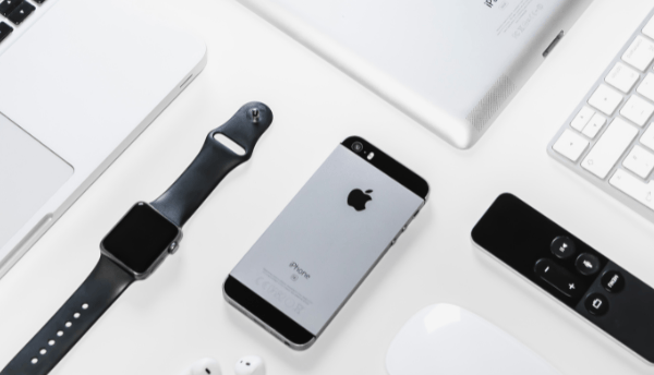 an apple products on the table watch ,phone,i pods,etc
