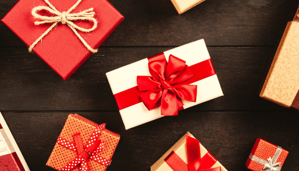 many gift boxes with ribbon on it