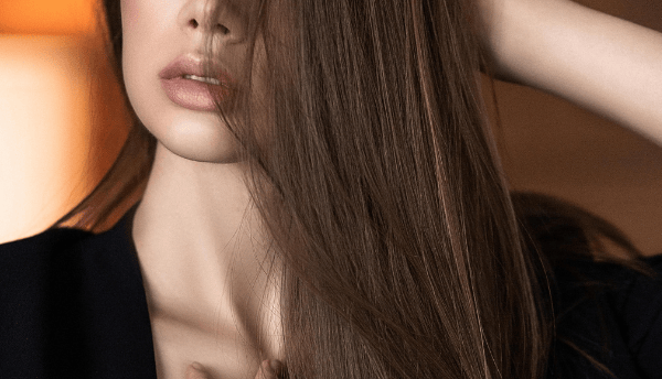 a girl with long hair standing