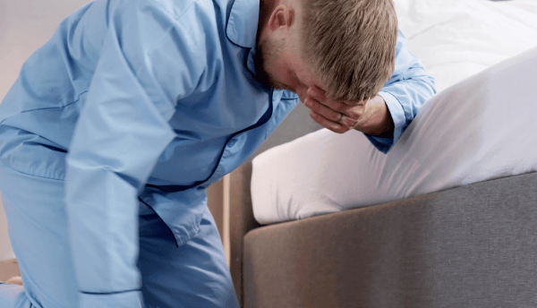 a man is filling dizziness and glass on the floor