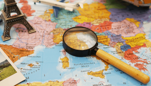 a magnifier glass is top of the map