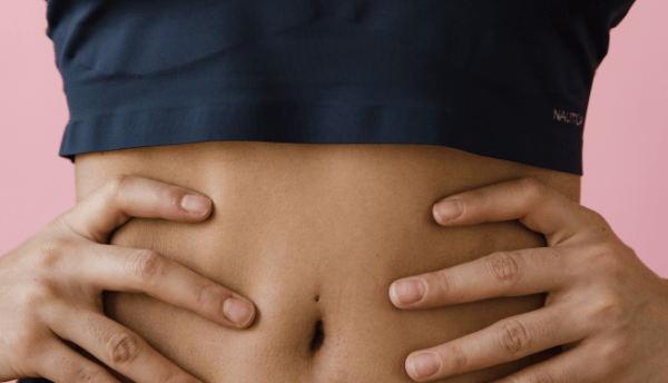 a women holding- belly