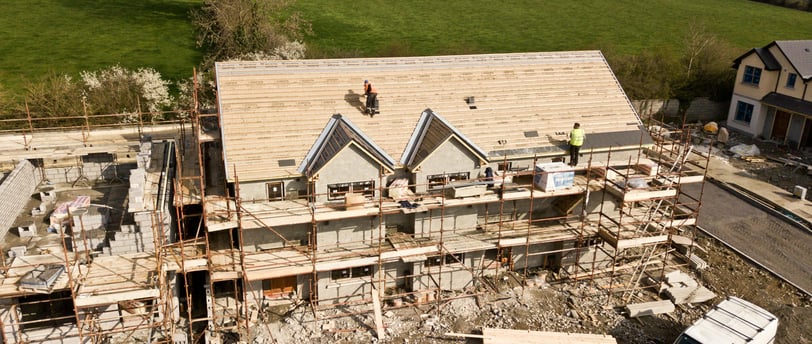 house building with scaffholding