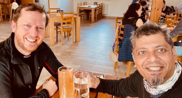 Enjoying a drink with fellow motorcyclist in Czechia