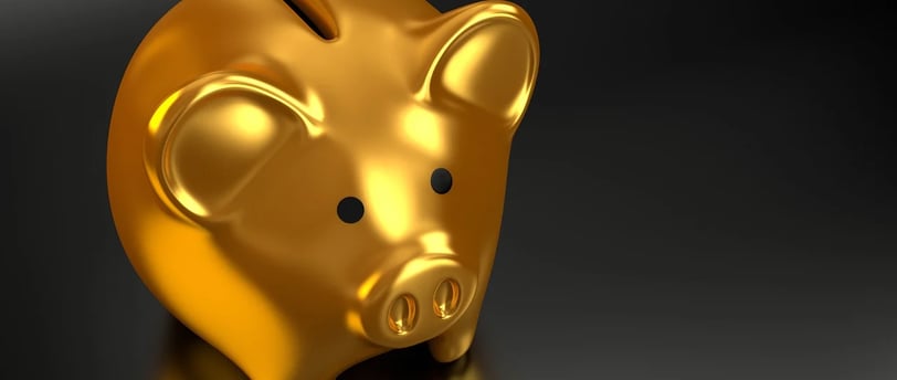 A gold colored piggy-bank