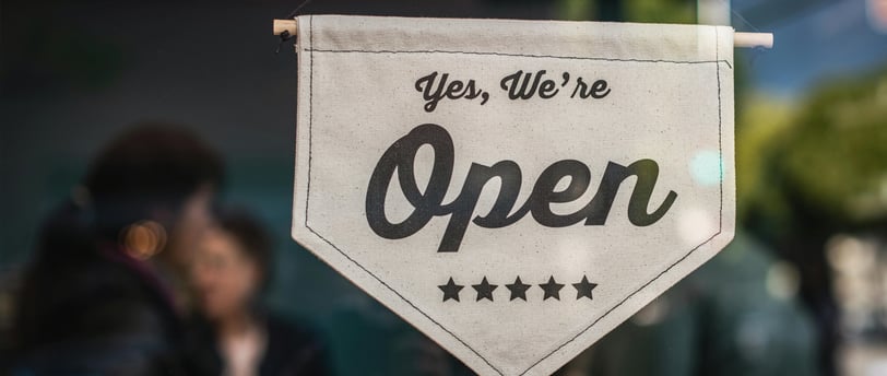 a sign that says yes we're open
