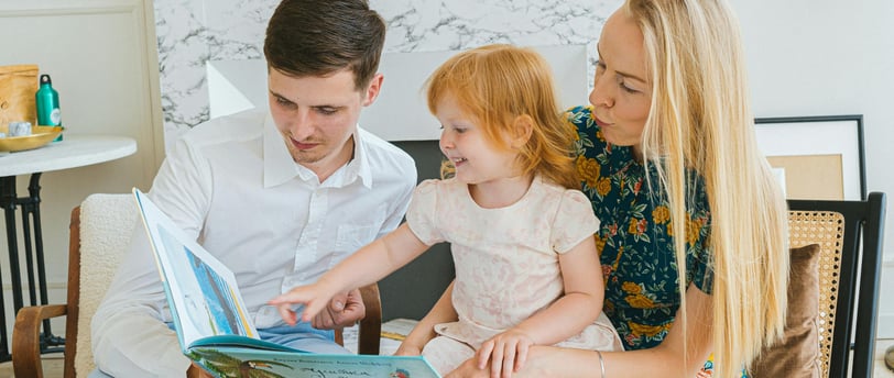 A parent and child sitting together, having an open and honest conversation in a calm and supportive