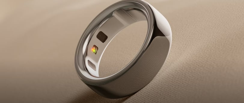 a ring with a yellow and red stone- Oura ring
