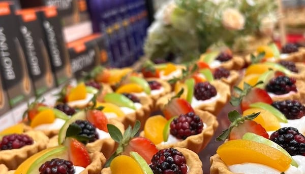 a variety of desserts on display in a store
