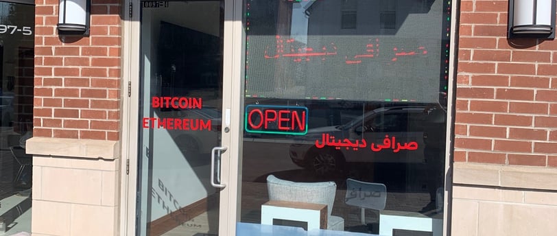 a crypt king storefront door with crypt currency