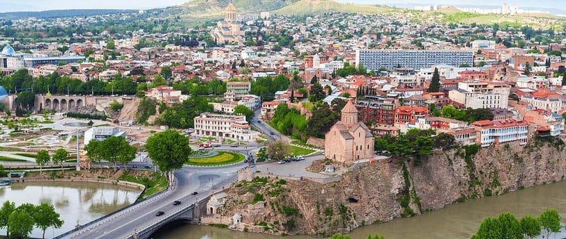 Panoramic view of Tbilisi from Narikala Fortress at sunset, Traditional sulfur baths in the Abanotub