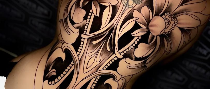 The Clover Ink tattoo artist inking tourist in Bali