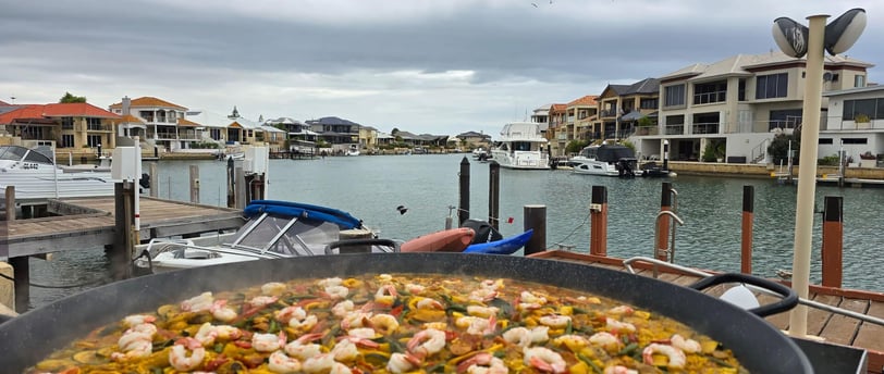 Serving Kamal's legendary Paella on the Mandurah estuary 