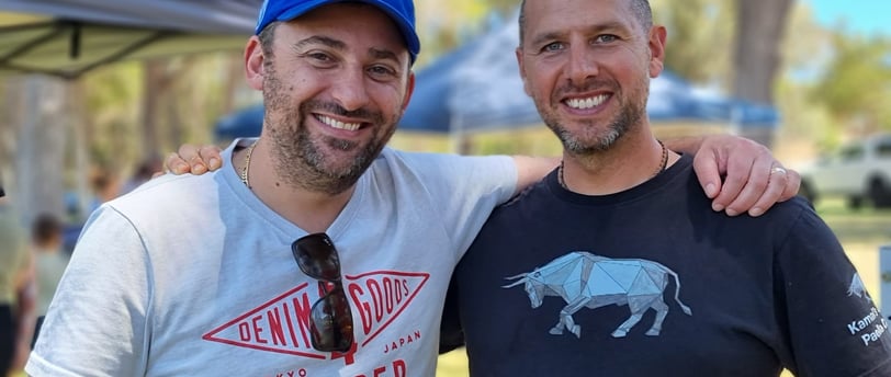 Kamal Alforo with guest at a Paella catering event