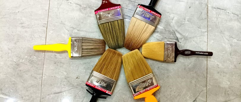 a group of paintbrushs with paintbrushes of different colors