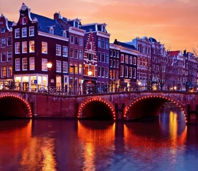Amsterdam - a bridge over a river with a bridge over it