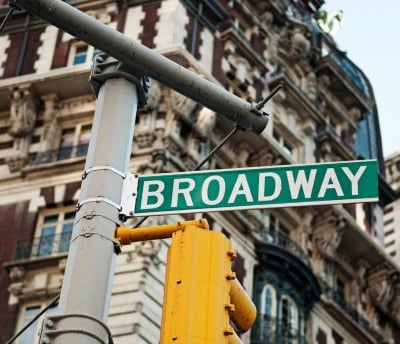 a street sign that says broadway broadway