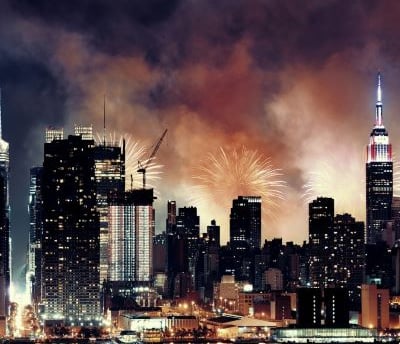 fireworks in the sky over a new york city skyline