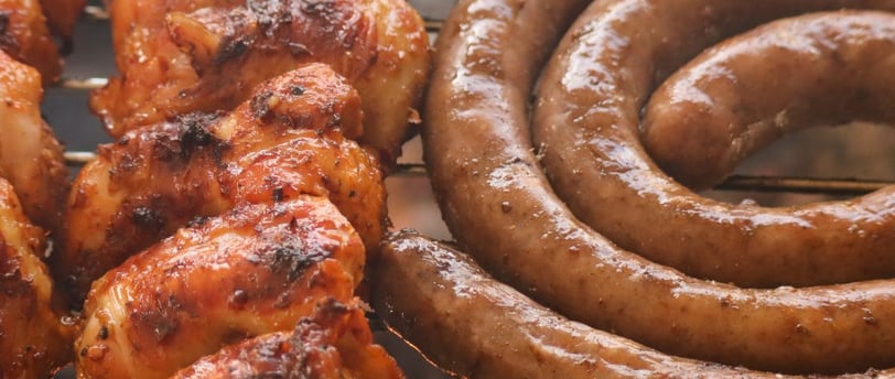 a grill with sausages and sausages on it
