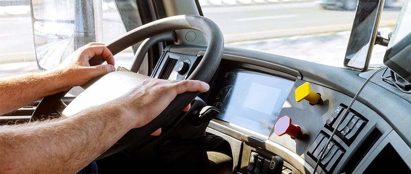 truck driver holding steering wheel