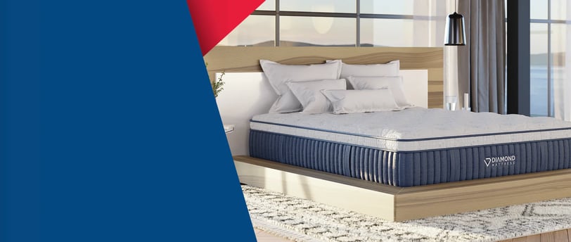 a Diamond bed with a mattress and pillows on it