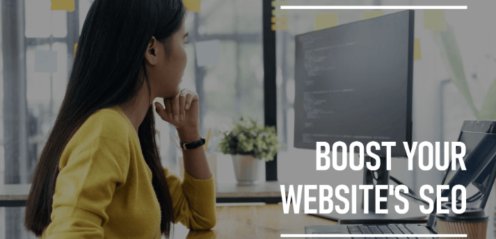 a woman sitting at a desk with a computer researching about website's seo