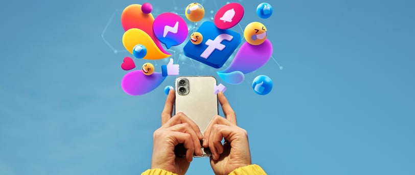 a person holding a cell phone with social media icons