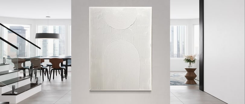 a large white wall with a painting on it