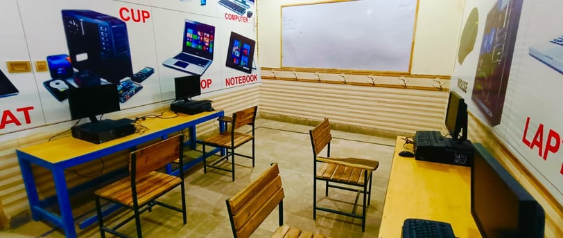 a room with a laptop and a laptop on a table
