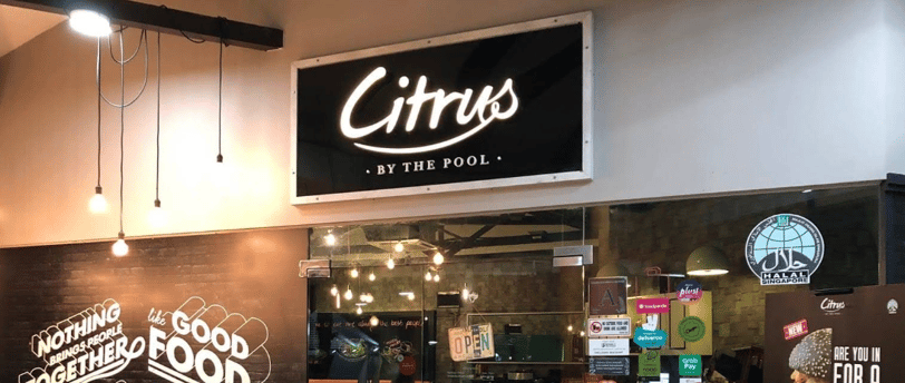 a restaurant with a sign that says citrus by the pool
