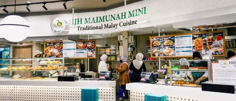 a restaurant with a large display of food and drinks