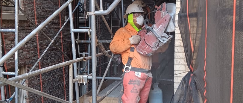 Andrew Horan with crew at clean demolition site in NYC, rebuilding Alba Services reputation through