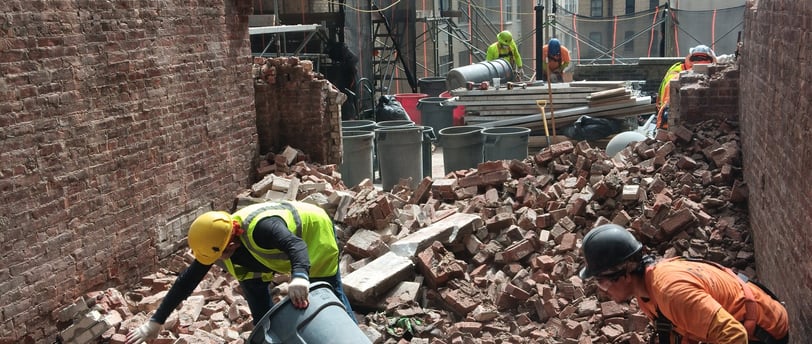 Andrew Horan overseeing clean demolition site in NYC, symbolizing leadership and trust at Alba Servi