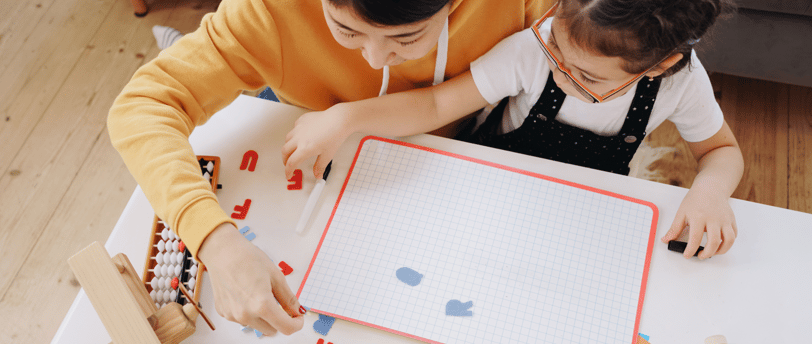 mother and daughter working on homeschool project together