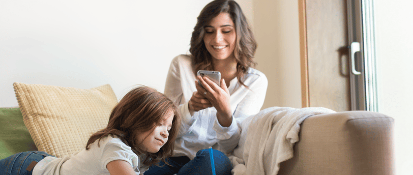 mom using app on her smartphone