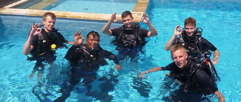 Students practicing diving skills in pool at Lovina Reef with instructor, Sunrise Dive Bali