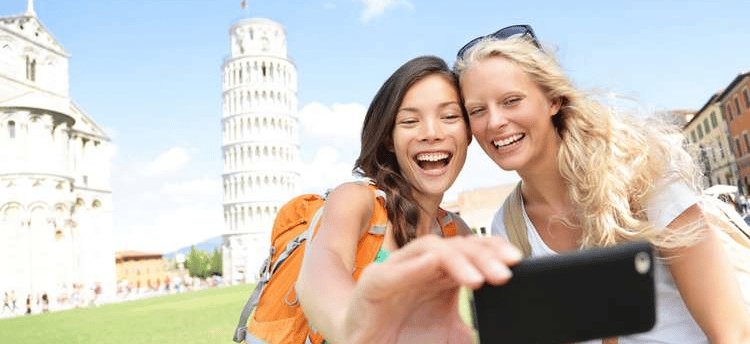two women taking a selfie with a camera